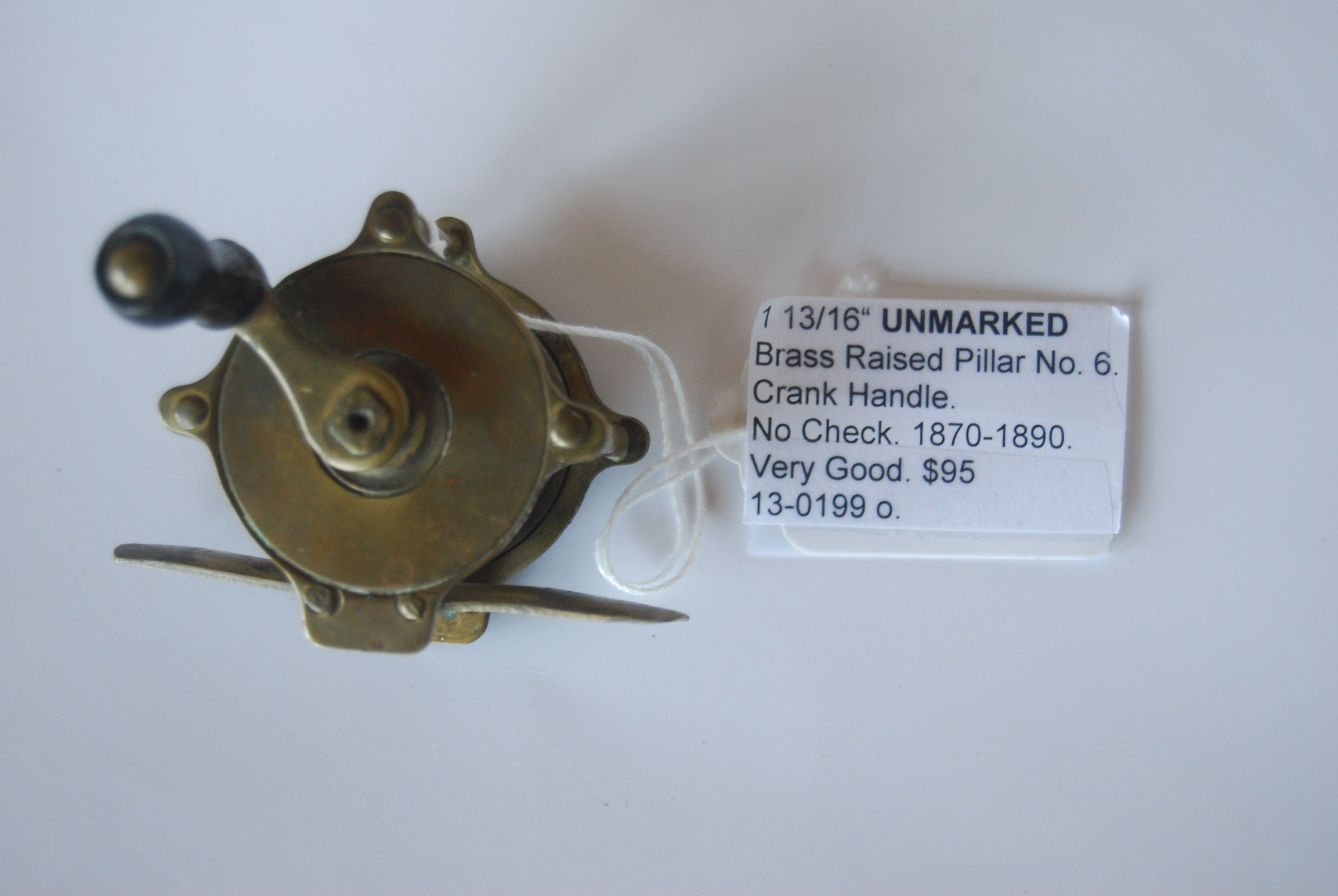 Image for 1 13/16” UNMARKED Brass Raised Pillar Reel No. 6. 7/8 in. pillars. No Check; Wood knob on crank handle; Marked “6” on foot. Circa 1870-1890. 2 oz.